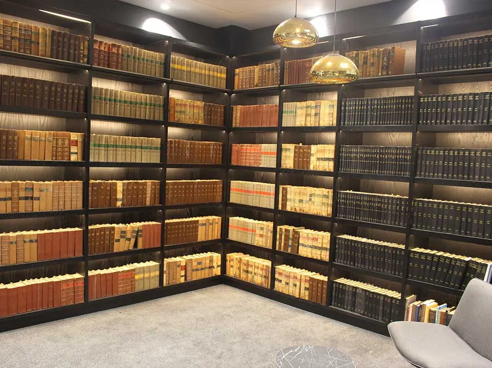 Illuminated library shelves and lounge seating