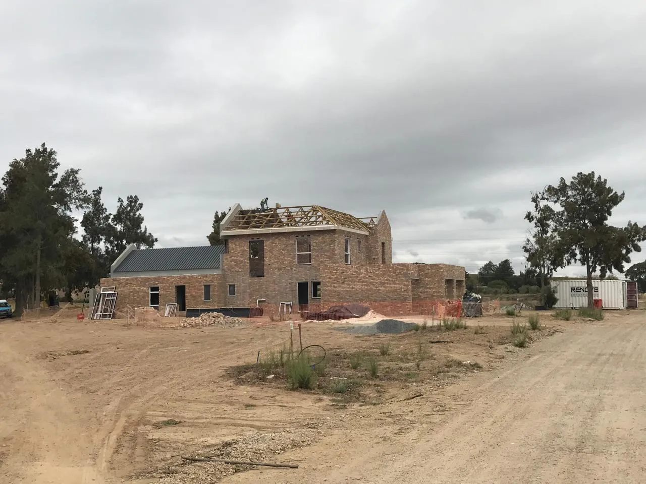 Devonvale residence with trusses on the main roof and sheeting on the wing