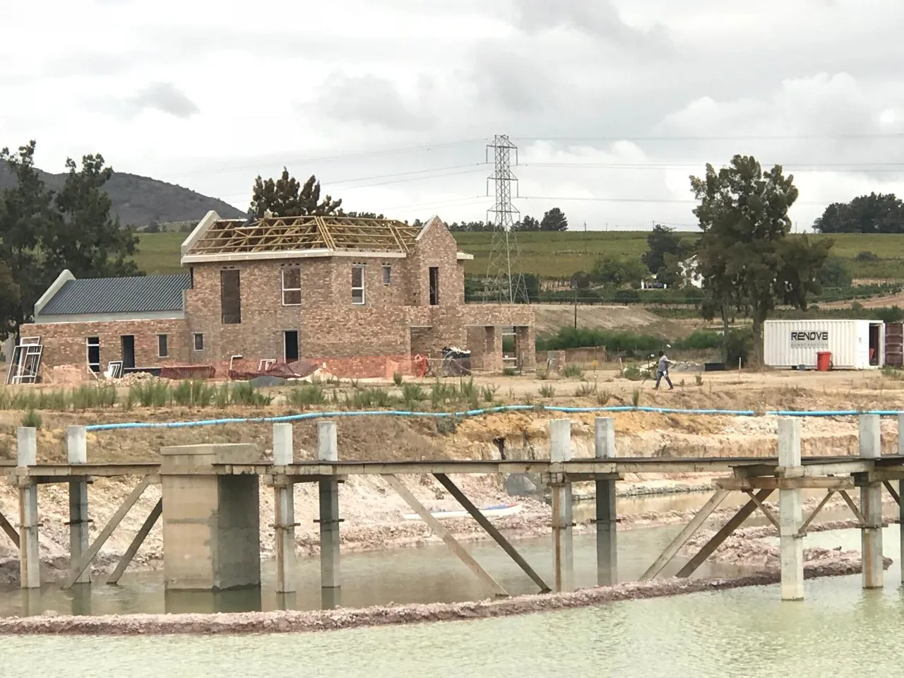 Devonvale residence seen across the dam and its timber boardwalk