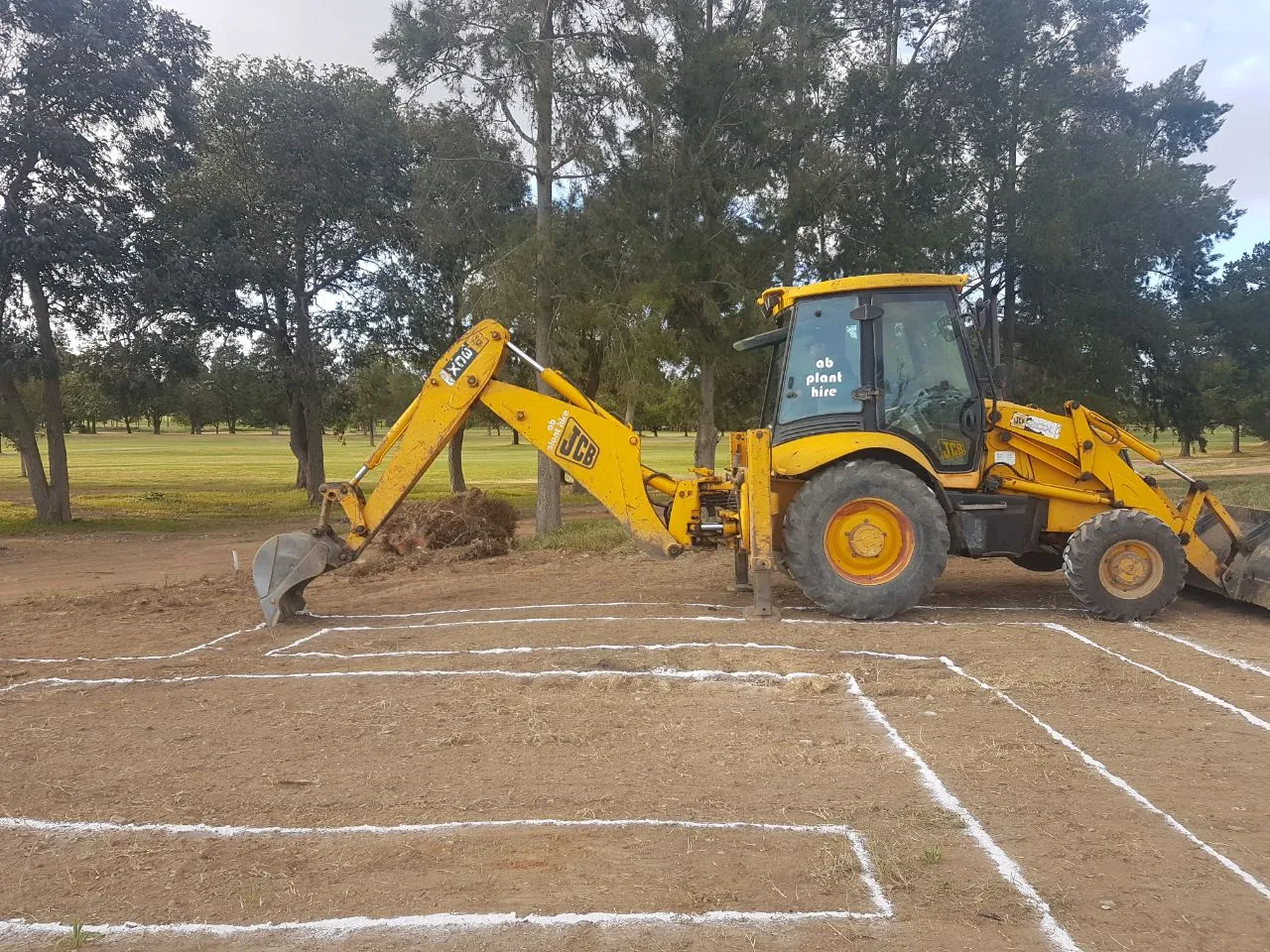 Site setting-out with a backhoe loader at Devonvale